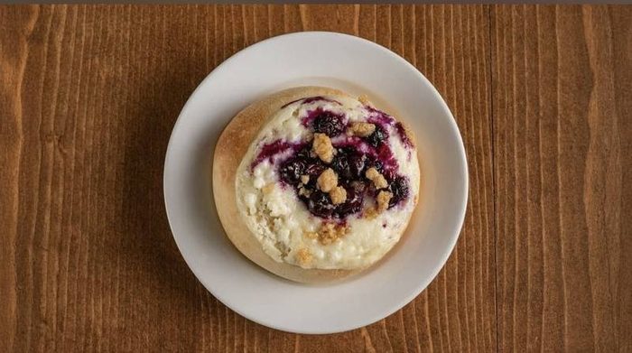 Sweet blueberry cream cheese kolache on a plate