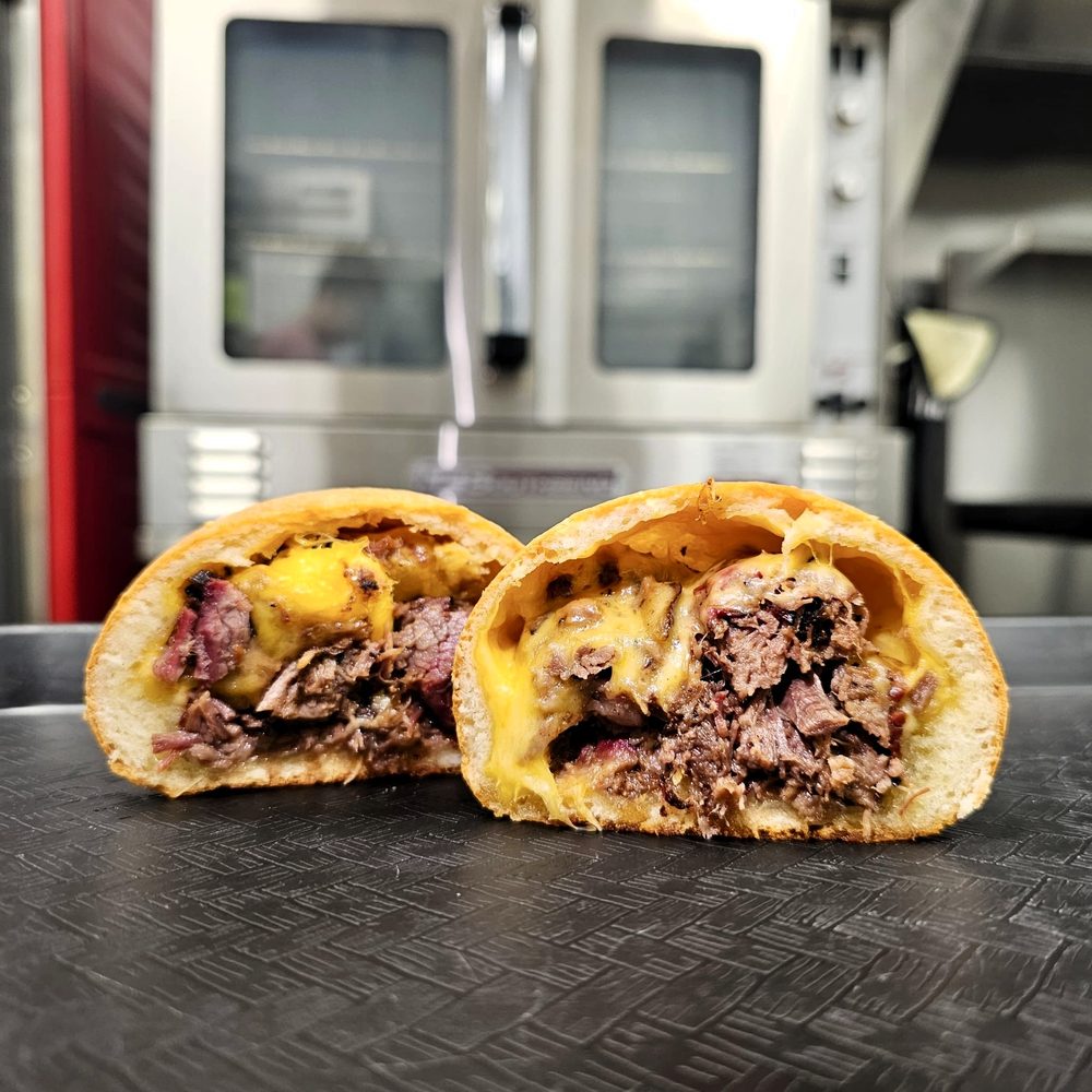 Texas brisket and cheddar kolache cut open at AllyAnne's